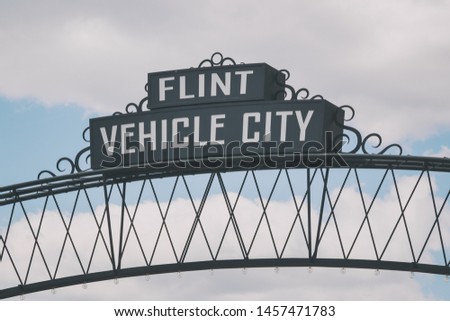 Flint, Michigan downtown gateway sign showing Vehicle City. Known widely for their water quality and safety issues.
