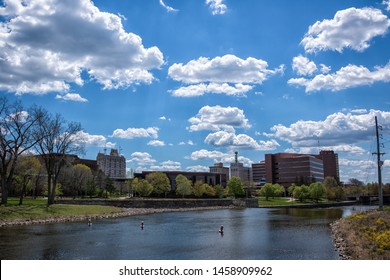 Flint, Michigan - May 14, 2019: Flint, Michigan Skyline And The Flint River. Known Widely For Their Water Quality And Safety Issues. Shot In On A Beautiful Spring Day.