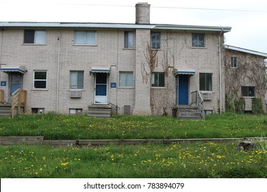 FLINT, MICHIGAN-DECEMBER 30, 2017:  Low income housing with uncut grass and weeds.  Many units are abandoned.
