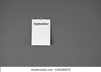 Flip Calendar Hanging On Grey Wall