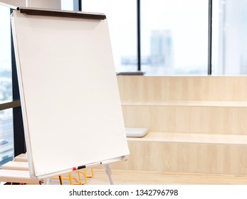 Flip Chart  With Blurred Background Of Conference Steps Chairs At Meeting Room. Flip Chart In Conference Room For Explain Or Share New Idea With Team. Copy Space