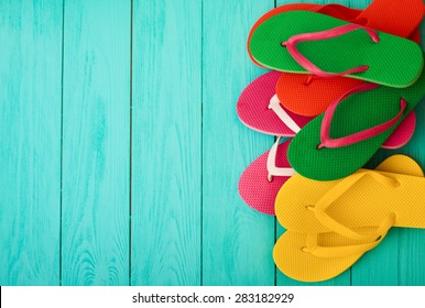 Flip flops on blue wooden background - Powered by Shutterstock