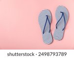 Flip flops on a bright colored background. Sandals. Summer Slippers. Vacation Concept. Rubber Slide Sandal . Top view. Space for text. Copy space