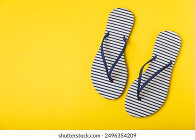 Flip flops on a bright colored background. Sandals. Summer Slippers. Vacation Concept. Rubber Slide Sandal . Top view. Space for text. Copy space