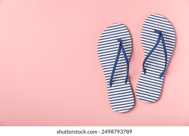 Flip flops on a bright colored background. Sandals. Summer Slippers. Vacation Concept. Rubber Slide Sandal . Top view. Space for text. Copy space