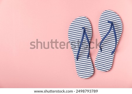 Flip flops on a bright colored background. Sandals. Summer Slippers. Vacation Concept. Rubber Slide Sandal . Top view. Space for text. Copy space