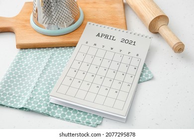 Flip Paper Calendar With Utensils On Table