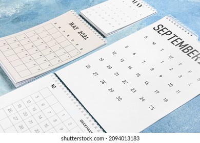 Flip Paper Calendars On Color Background, Closeup