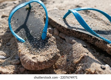 Flipflop sandals on the beach in a sand, travelling and resort concept