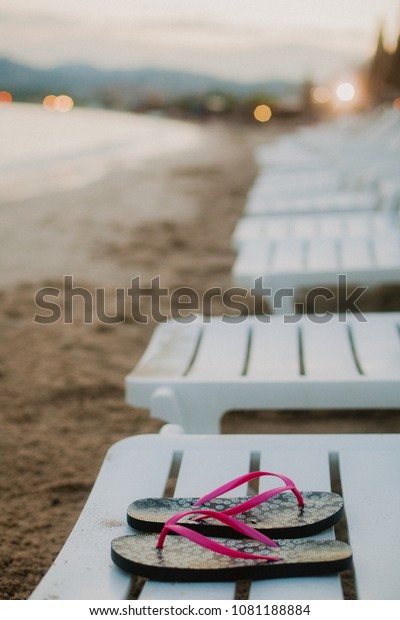 Flipflops On Bench On Seashore Stock Photo Edit Now 1081188884