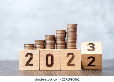 flipping 2022 to 2023 year block with Coins stack. Money, Budget, tax, investment, financial, savings and New Year Resolution concepts - Shutterstock ID 2171990861