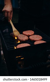 Flipping Burgers On A Grill