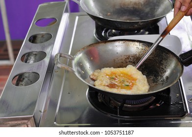 Flipping Thai Style Omelette By Flipper In A Hot Pan, One Step Of Cooking