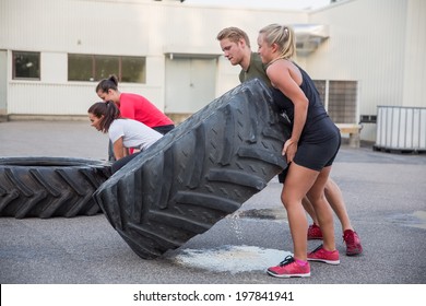 Flipping tractor tires as outdoor workout - Powered by Shutterstock