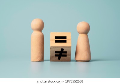 Flipping Of Unequal To Equal Sign Between Man And Woman Wooden Figure. Human And Business Right Concept. 