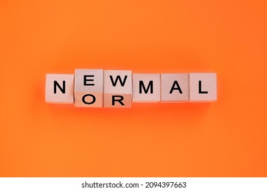 Flipping Wooden Cubes With NEW NORMAL Word. Text New Normal Written On Wooden Cube Blocks.