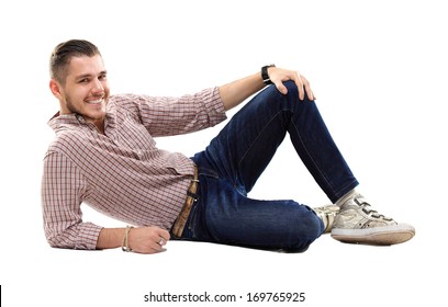 Flirtatious man sitting on the floor