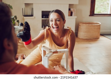 Flirting Playful Girlfriend Teases Boyfriend, Moving To Apartment, Remodel Construction Furniture And Diy Interior Design Building. Laughing And Happy Couple Love Having Fun Redecorate Lounge.