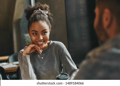 Flirty Girl. Man And Woman Have A Meeting In A Modern Cafe