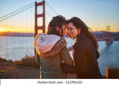 flirty lesbian couple in love at golden gate bridge