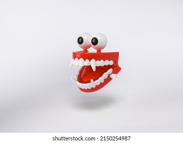 Floating Clockwork jaw with vampire fangs on white background with shadow