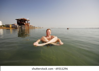 Floating In The Dead Sea - Israel