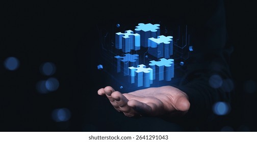 Floating digital puzzle blocks above a human hand in a futuristic graphic style on a dark background, symbolizing innovation and technology
