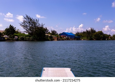 Floating Dock On A Lake With Cloudy Blue Sky View