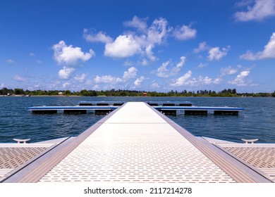 Floating Dock On A Lake With Cloudy Blue Sky View