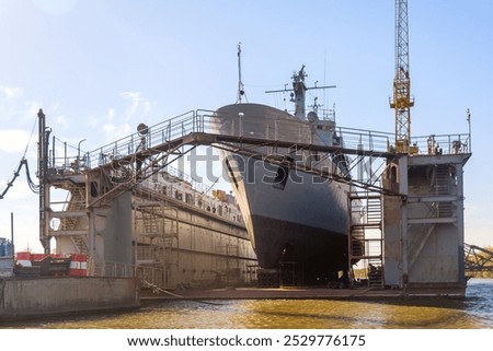 Floating dry dock with a ship under repair maintenance inside