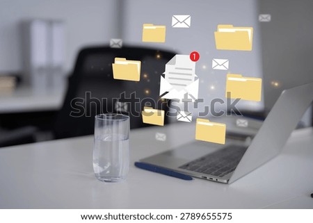 floating email envelope folder icons notification badge laptop computer workspace digital communication file management