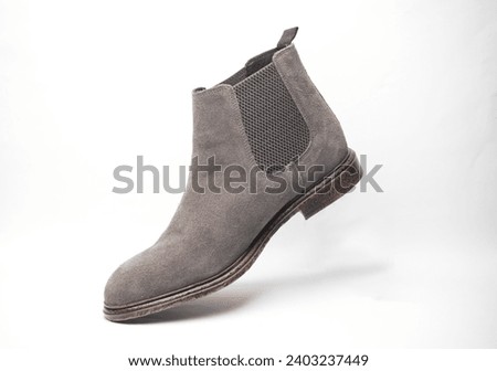 Floating gray suede Chelsea boot on white background ストックフォト © 