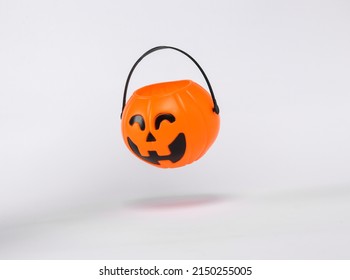 Floating Halloween Jack Pumpkin Bucket On White Background With Shadow. Trick Or Treat