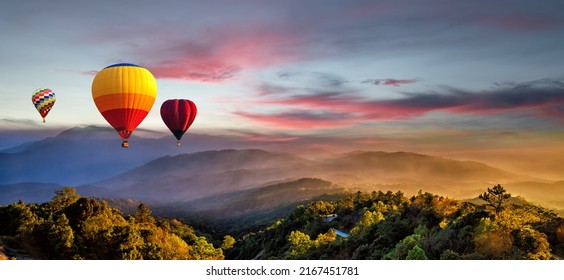 Floating hot air balloons in colorful sky on sunset mountain view, Chiang Mai Thailand - Shutterstock ID 2167451781