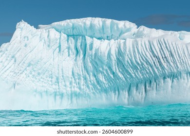 Floating Iceberg with Compressed Ripple Structured Ice in Antarctica