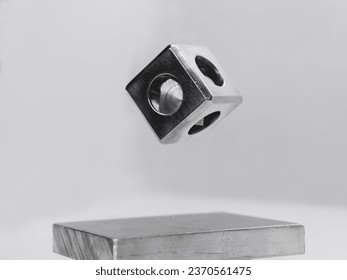 floating iron object cube, cube inside cube iron metal, flying object white and silver grey, technological future scifi, science fiction