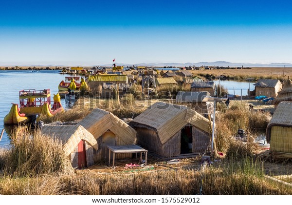A floating island\
made of totora reeds, inhabited by the Uru people, on Lake\
Titicaca. The lake divides Peru and Bolivia, with these islands\
just off the shore from Puno.\
