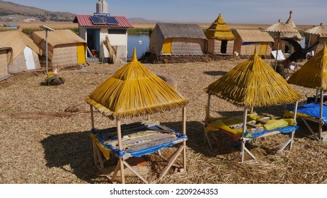 The floating islands of Uros on Lake Titicaca, yellow straw houses, tourist visit, first civilization of the Incas, maritime inhabitants, summary and natural construction