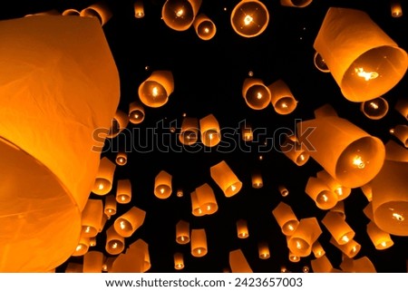 The Floating Lanterns Festival: A mesmerizing spectacle of illuminated lanterns adrift on water, symbolizing hopes, dreams, and cultural unity.




