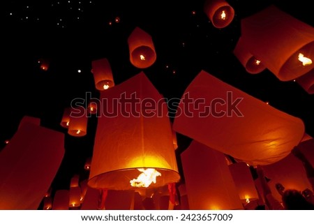 The Floating Lanterns Festival: A mesmerizing spectacle of illuminated lanterns adrift on water, symbolizing hopes, dreams, and cultural unity.




