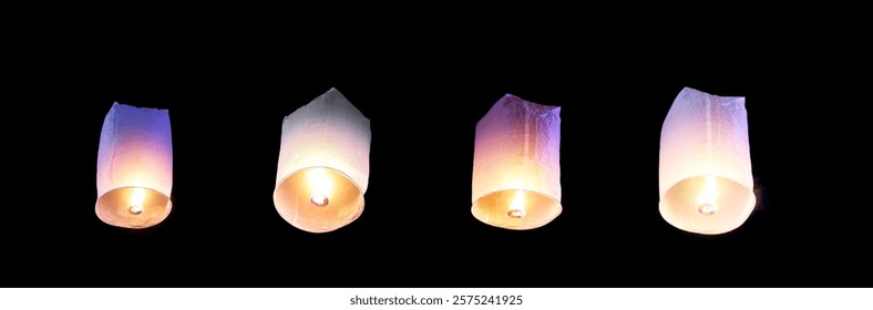 Floating lanterns on a dark sky background