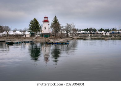 Floating Light House between clouds and water. Photo is taken on March 25, 2021 at 1391 Lake Shore Blvd W, Toronto, ON M6K 3C1, Canada. 

