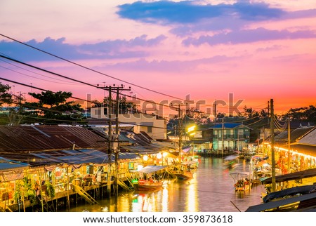 Floating market food at night in the river at Amphawa, Samut Songkhram Province, Thailand. The culture travel local boat in canal water. The Asia tourism concept