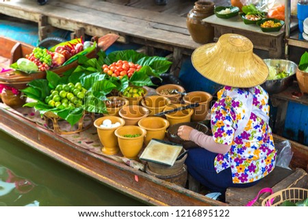 Floating market in Thailand in a summer day