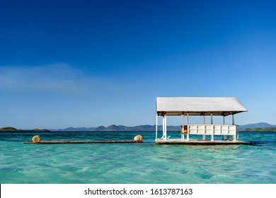 Floating ocean terrace on the beautiful tropical pass island in the Philippines. Traveling and beach vacation scene.