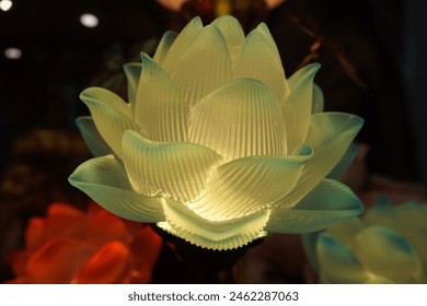 Floating on pure water Diya lamps lit and beautiful lotus flowers for Diwali celebration. Dreamy wallpaper with lanterns and lotuses with green leaves on magical calm pond for Hindu festival of lights - Powered by Shutterstock