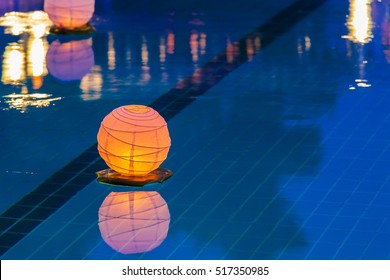 Floating orange water lantern in the pool