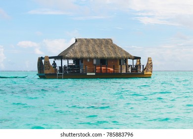 Floating Polynesian Boat Restaurant On The Turquoise Sea In Tahaa, Raiatea In French Polynesia
