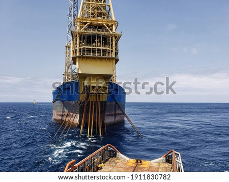 Floating production storage and offloading (FPSO) vessel, oil and gas indutry. View from ship. Supply DP operations