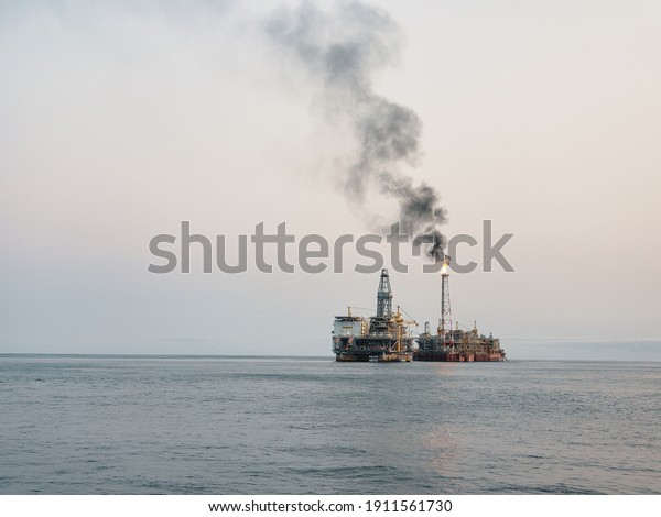 Floating\
production storage and offloading (FPSO) vessel with Oil Platform,\
oil and gas indutry. Production is in\
progress.